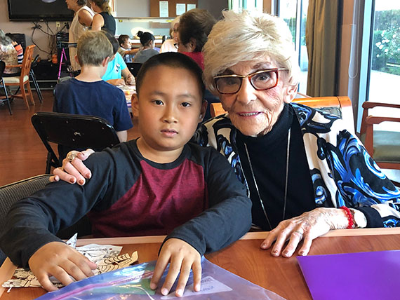 Seniors and Grade School Kids Gather for Laughter, Conversation